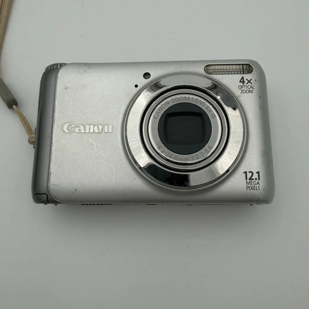 Canon PowerShot A3100 IS Camera Silver w/ Battery Charger Well Loved